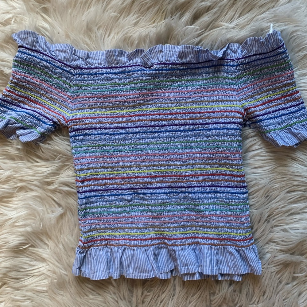 An off the shoulder colorful top